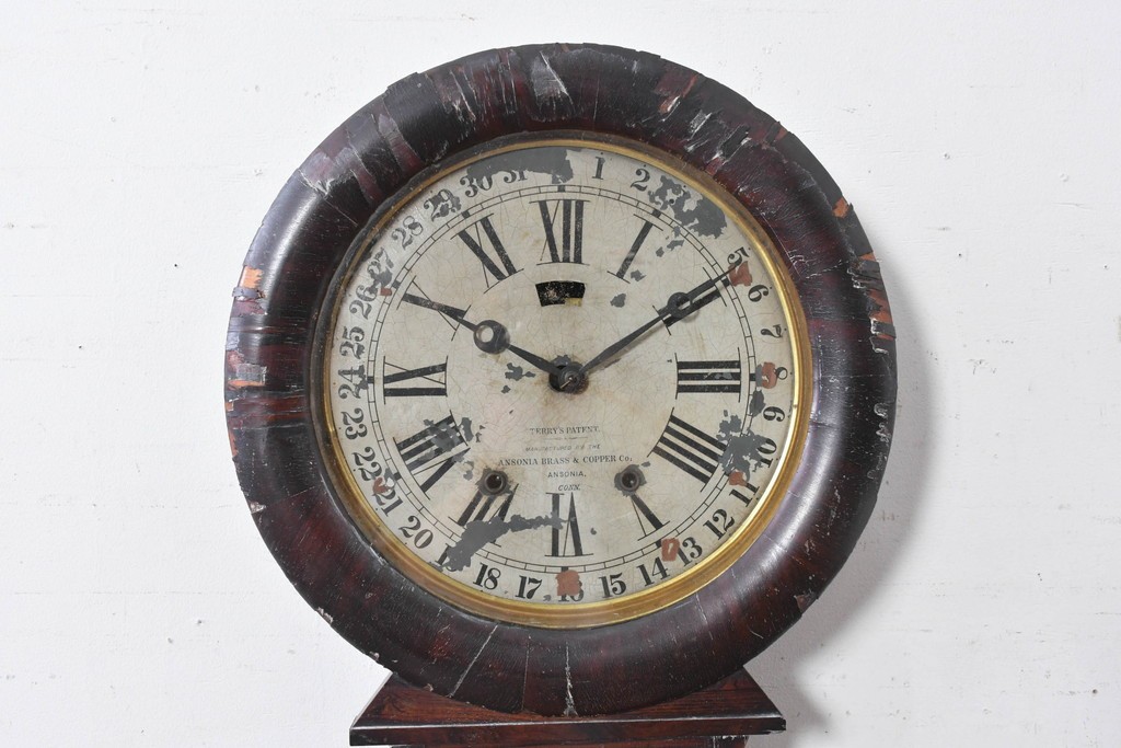 アメリカアンティーク　1870年頃　Ansonia Clock Company(アンソニア)　ローマ数字と日付目盛りを配した丸型文字盤の掛け時計　(R-091835)